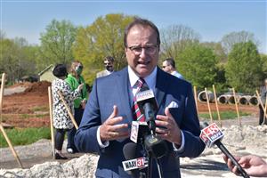 Madison City Schools Superintendent Dr. Ed Nichols speaking to reporters at construction site 